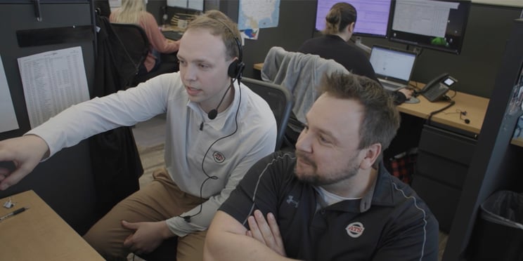 Two-Men-Collaborating-at-Desk